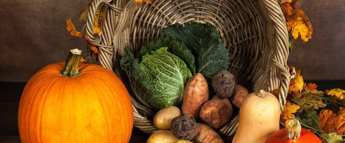 Various fruits and vegetables including pumpkin and potatoes